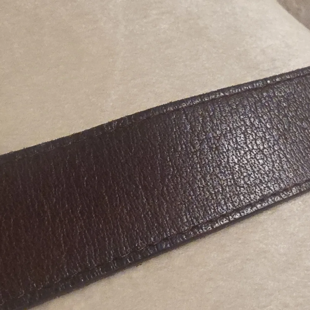 Linea Pelle Dark Brown Leather Belt with Brass-Tone Embossed Buckle